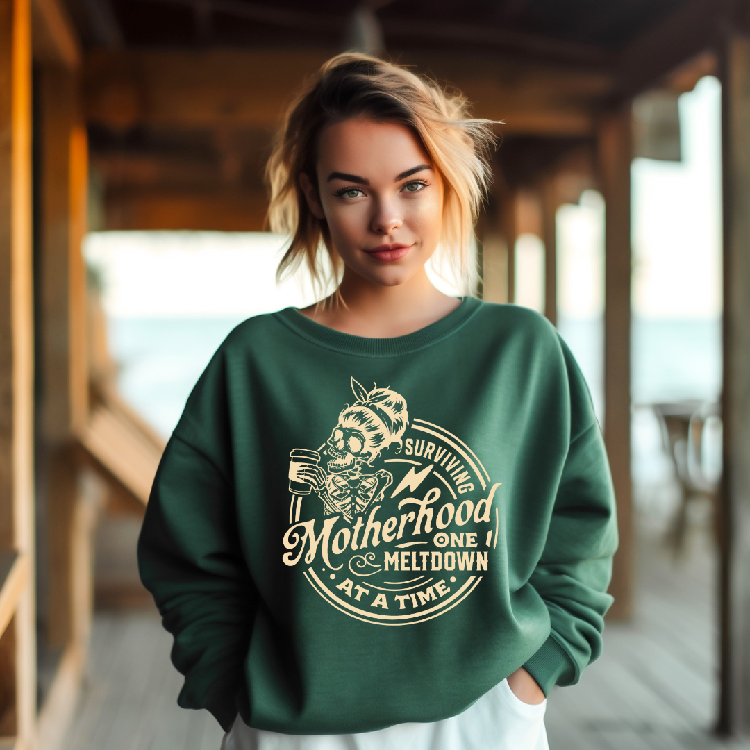 "Surviving Motherhood, One Meltdown About A Time" Graphic Ladies Crewneck Sweater