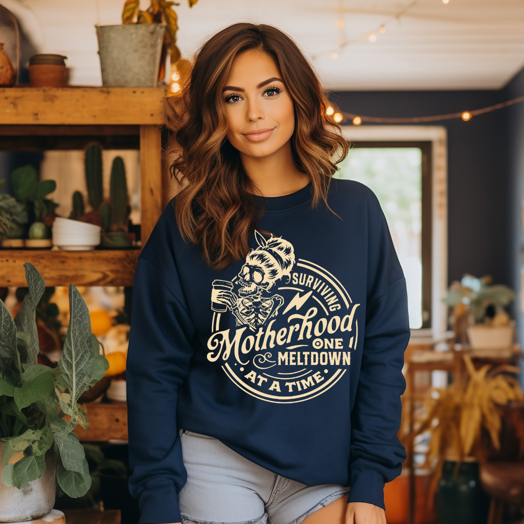 "Surviving Motherhood, One Meltdown About A Time" Graphic Ladies Crewneck Sweater